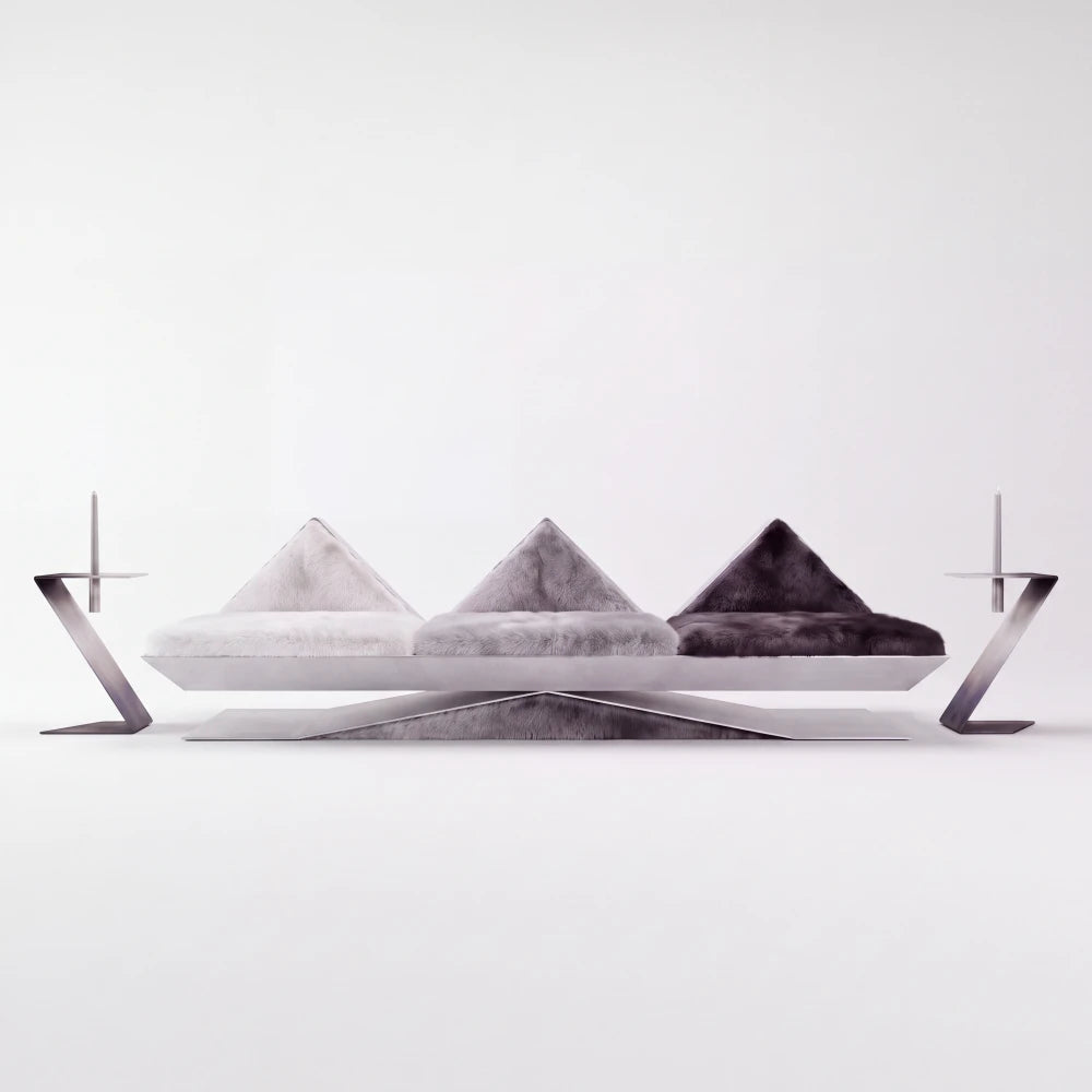 Front view of the Vertice sofa by Diamant Versatile, with three geometric fur seats resting on a faceted brushed metal base.